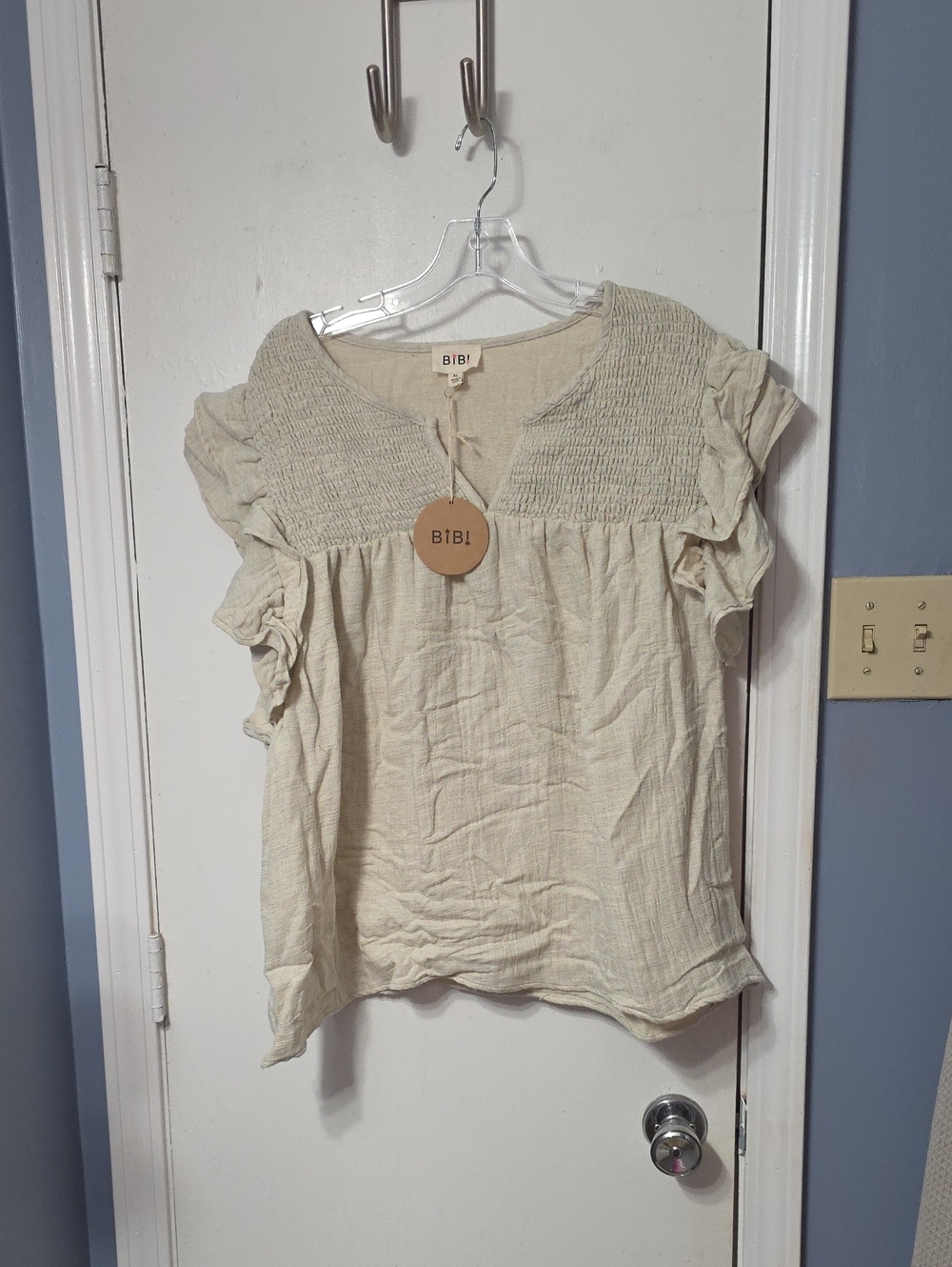 BiBi Cream Smocked Yoke Ruffle Sleeve Top